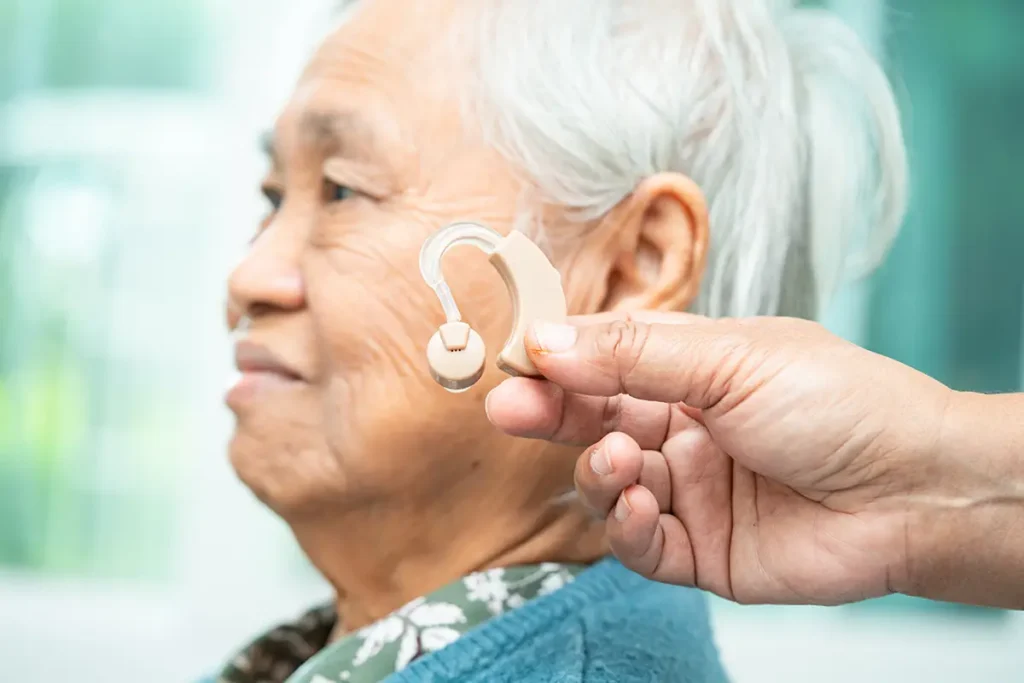 A hearing device for an older woman