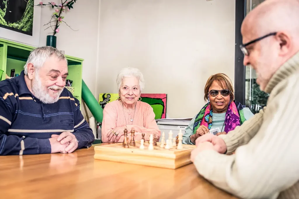 Older individuals playing chess